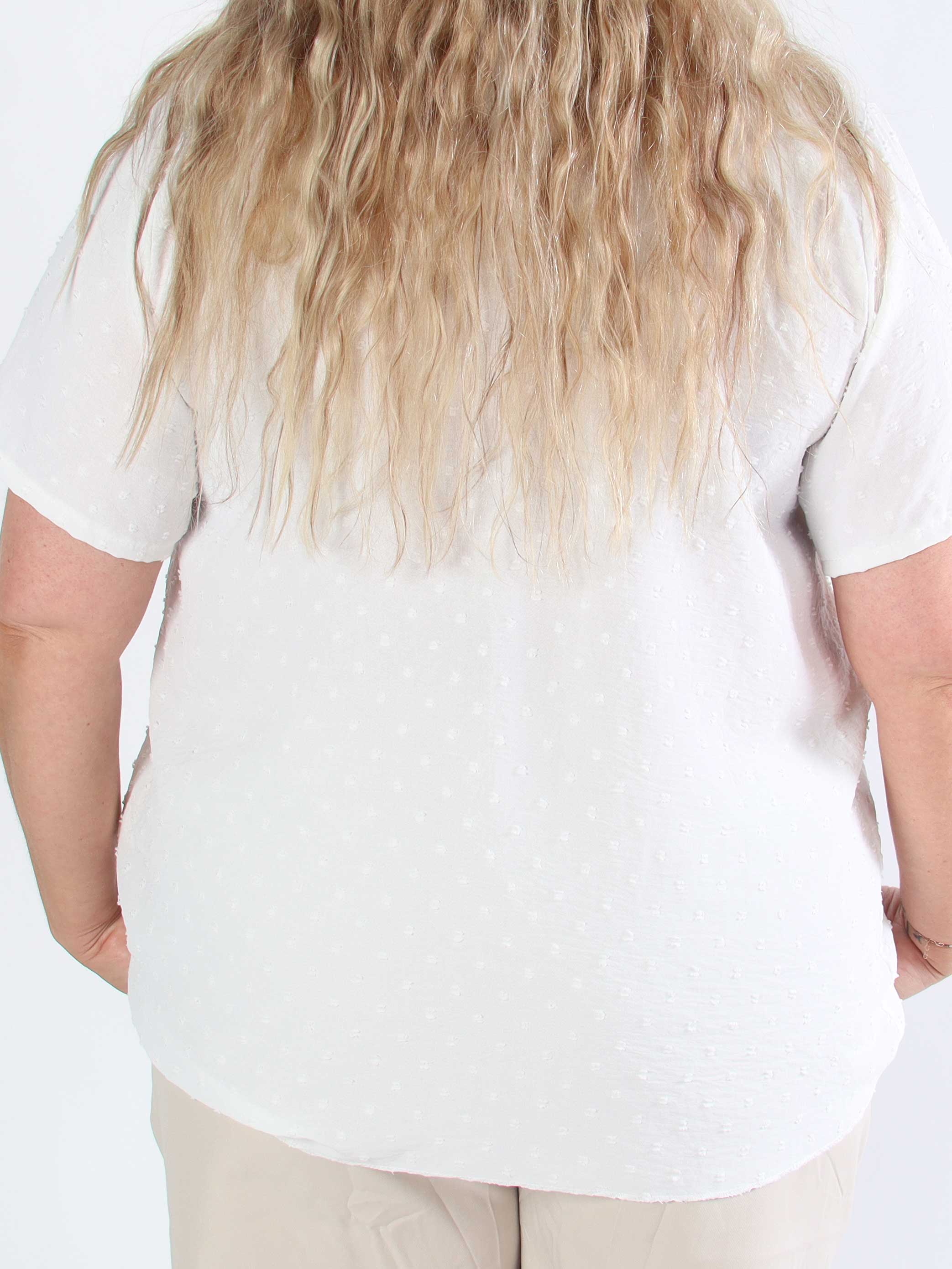 Bloom - Söt tunika i plusstorlek med volangkant och rosett